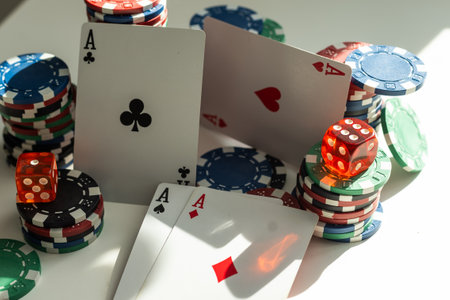 four aces with poker chips on white backgroundの写真素材