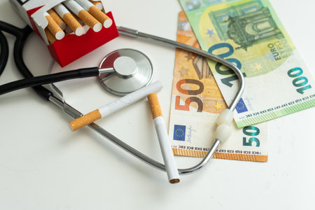 stethoscope and cigarette isolated white backgroundの写真素材