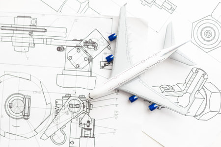 Miniature model airplane on a flight sectional map with focus on the foreground, background blur