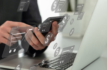 Online shopping and e-commerce concept. Young man using laptop computer with shopping cart icon,...