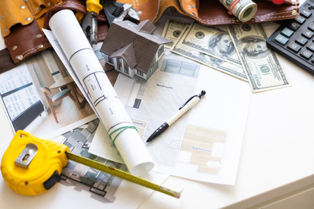 architectural drawings for houses with dollar, paints, brushes and accessoriesの写真素材