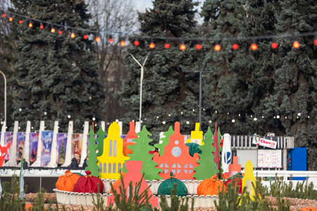 Christmas market in a European city. Wooden houses are illuminated by garlands and Christmas decorations in the evening. Christmas decorations at the fair.のeditorial素材