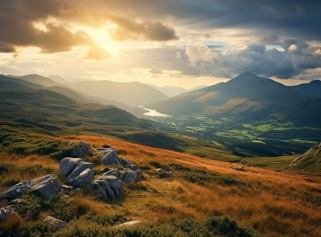 Wonderful springtime panoramic landscape in mountains at sunset. Grassy slopes and forested hills illuminated with morning sunshine. Wild scenery.の素材
