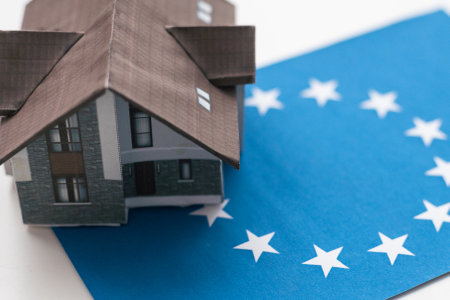 European Union symbol and small house.Isolated on white background.3d rendered.の写真素材