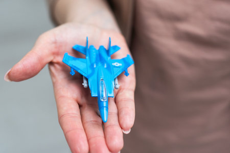 fighter plane model in hand