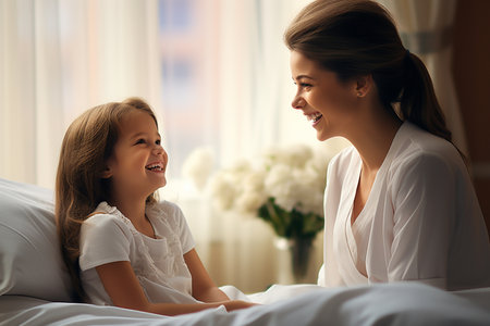 Beautiful young mother and her daughter.の素材