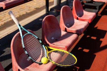 tennis racket and balls on the tennis courtの写真素材