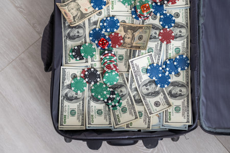 Open suitcase with one million dollars bills stacks