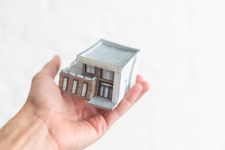 Property insurance concept, toy house