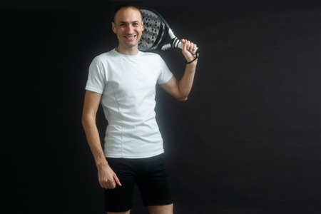 Young man playing the paddleの写真素材