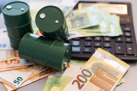 euro banknotes and oil barrel concept photoの写真素材