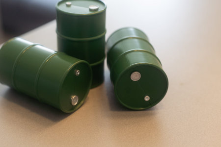 models of barrels with oil on the table