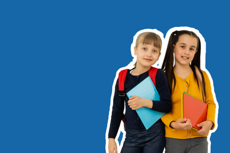school children copy space isolated over bright vivid shine vibrant blue color background