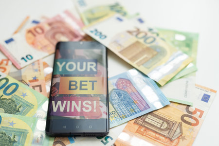 betting on sports, smart phone with working online betting mobile applicationの写真素材