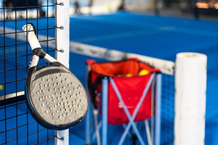 Paddle tennis rackets, balls and basket in court still lifeの写真素材