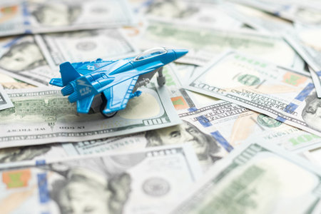 Military toy airplane jet aircraft - on money background