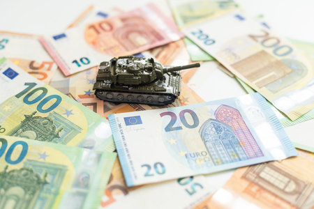 tank against the background of dollars. Concept of war.