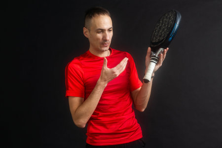 Paddle tennis: Man, Player with hand and Paddel racket and ballの写真素材
