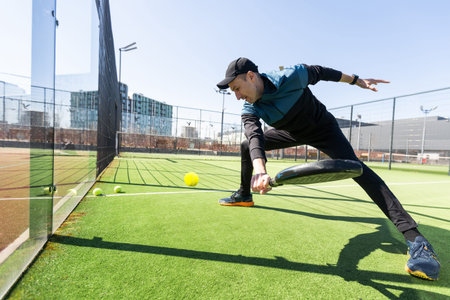 man playing paddle tennis at indoors pitch