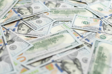 Banknotes of 100 American dollars top view, close-up.
