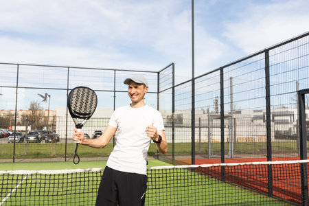 Padel match in a grass padel court - Padel player playing a matchの写真素材