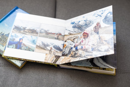 view open book with album at home