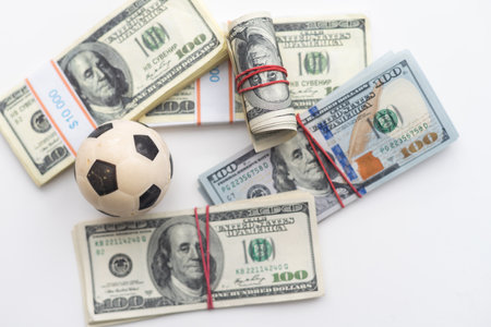 soccer ball over a lot of money. corruption football game. Betting and gambling concept. wold cupの写真素材
