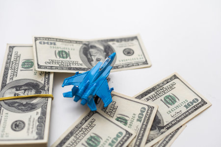 Toy plane and money on background. Travel insurance