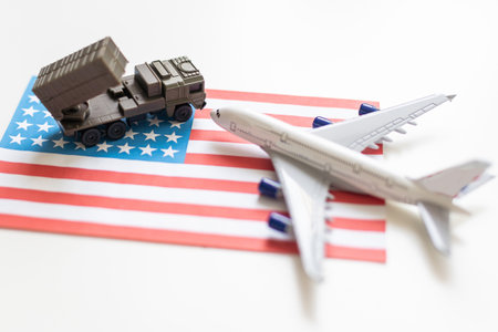 Miniature toy soldiers in battle scene with american flag background , Memorial Day conceptの写真素材