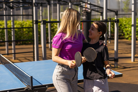 girl plays in table tennis outdoorの写真素材
