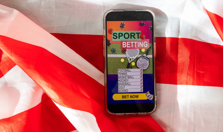 betting on sports, smart phone with working online betting mobile applicationの写真素材