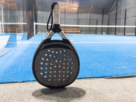 professional paddle tennis racket with natural lighting on blue background. Horizontal sport theme poster, greeting cards, headers, website and appの写真素材