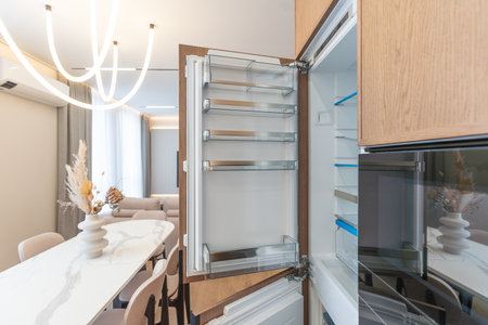 modern kitchen perfectly equipped with its appliances in a houseの写真素材
