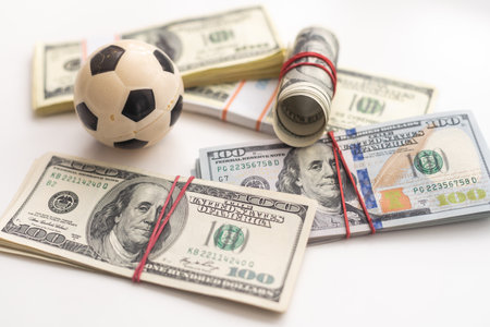 soccer ball over a lot of money. corruption football game. Betting and gambling concept. wold cupの写真素材