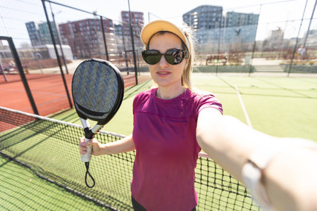 One women playing Paddle tennisの写真素材