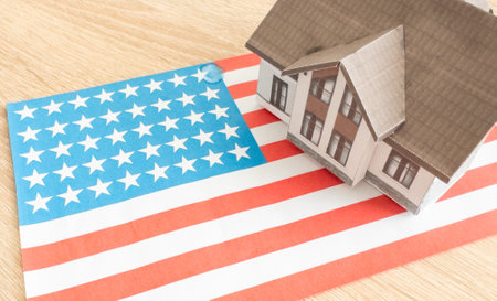 Small house on a flag - Living or migrating to United States of Americaの写真素材