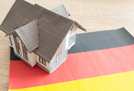 Small house on a flag - Living or migrating to Germanyの写真素材