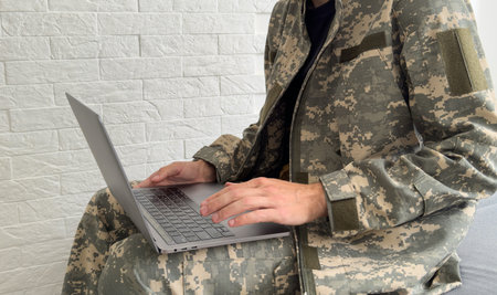 Soldier with laptop on white backgroundの写真素材