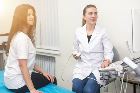 Ultrasound scanner in the hands of a doctor. Diagnostics. Sonography.