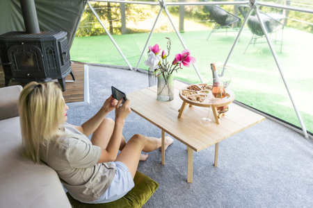 female tourist in transparent hotel domeの写真素材