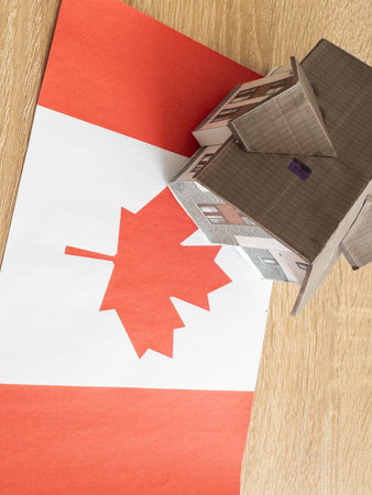 Small house on a flag - Living or migrating to Canadaの写真素材