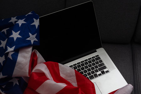 4th of July American Independence Day USA flags decorations in office desk with computer.の写真素材