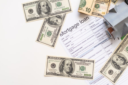 accountant working on Income tax forms or on budget planning with currency notes, calculator and house 3d Modelの写真素材