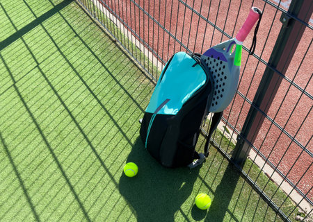 padel tennis racket and backpack in courtの写真素材