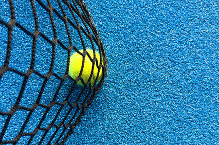 The tennis ball on the padel courtの写真素材