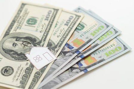 house layout and dollar bills on the backgroundの写真素材