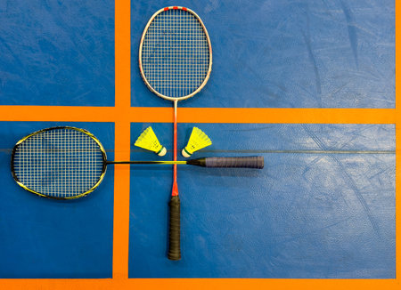 shuttlecock and badminton racket on the court