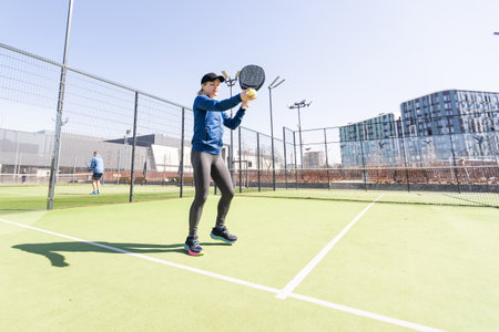 One women playing Paddle tennisの写真素材