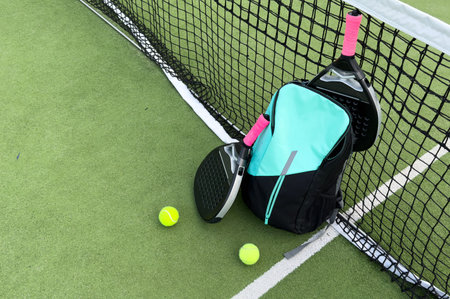 Padel tennis rackets. Sport court and balls. Download a high quality photo with paddle for the design of a sports app or soical media advertisementの写真素材
