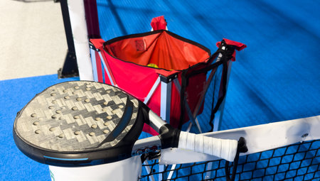 Blue padel and tennis net and hard court. Tennis competition concept. Horizontal sport theme poster, greeting cards, headers, website and appの写真素材